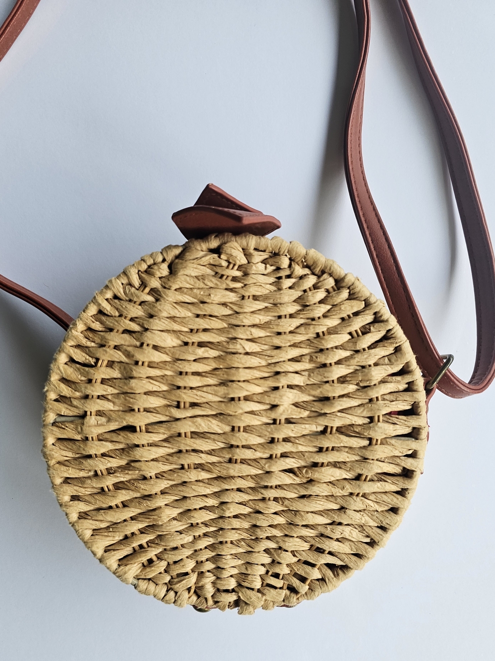 Round Woven Crossbody Bag with Tan Straw Body and Brown Strap